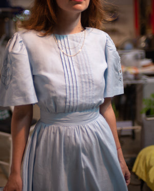 1980s linen pale blue puff sleeve fit and flair dress, 25” waist